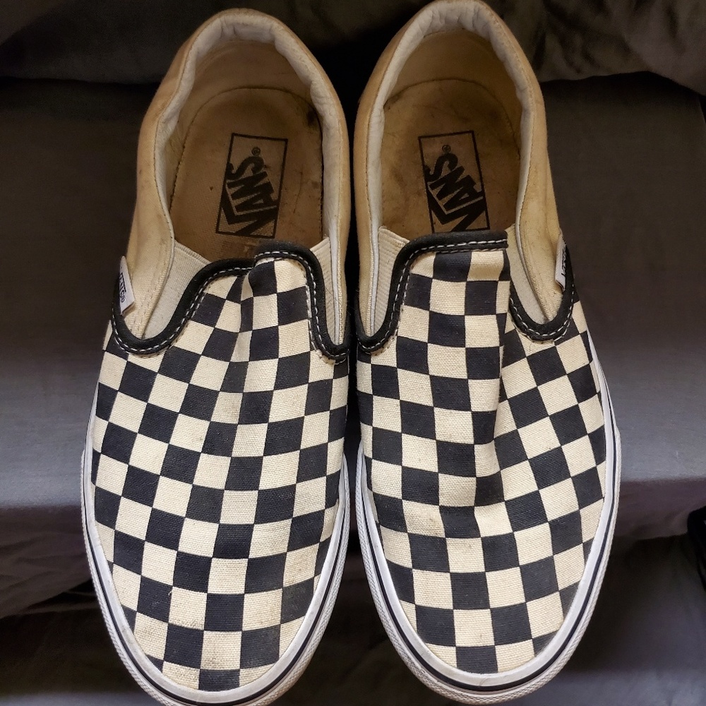 Black and white checkered VANS slip ons